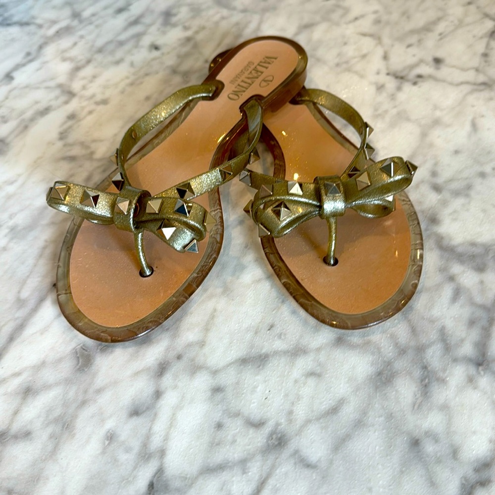 Valentino Garavani women’s Rockstud PVC flat thong sandals